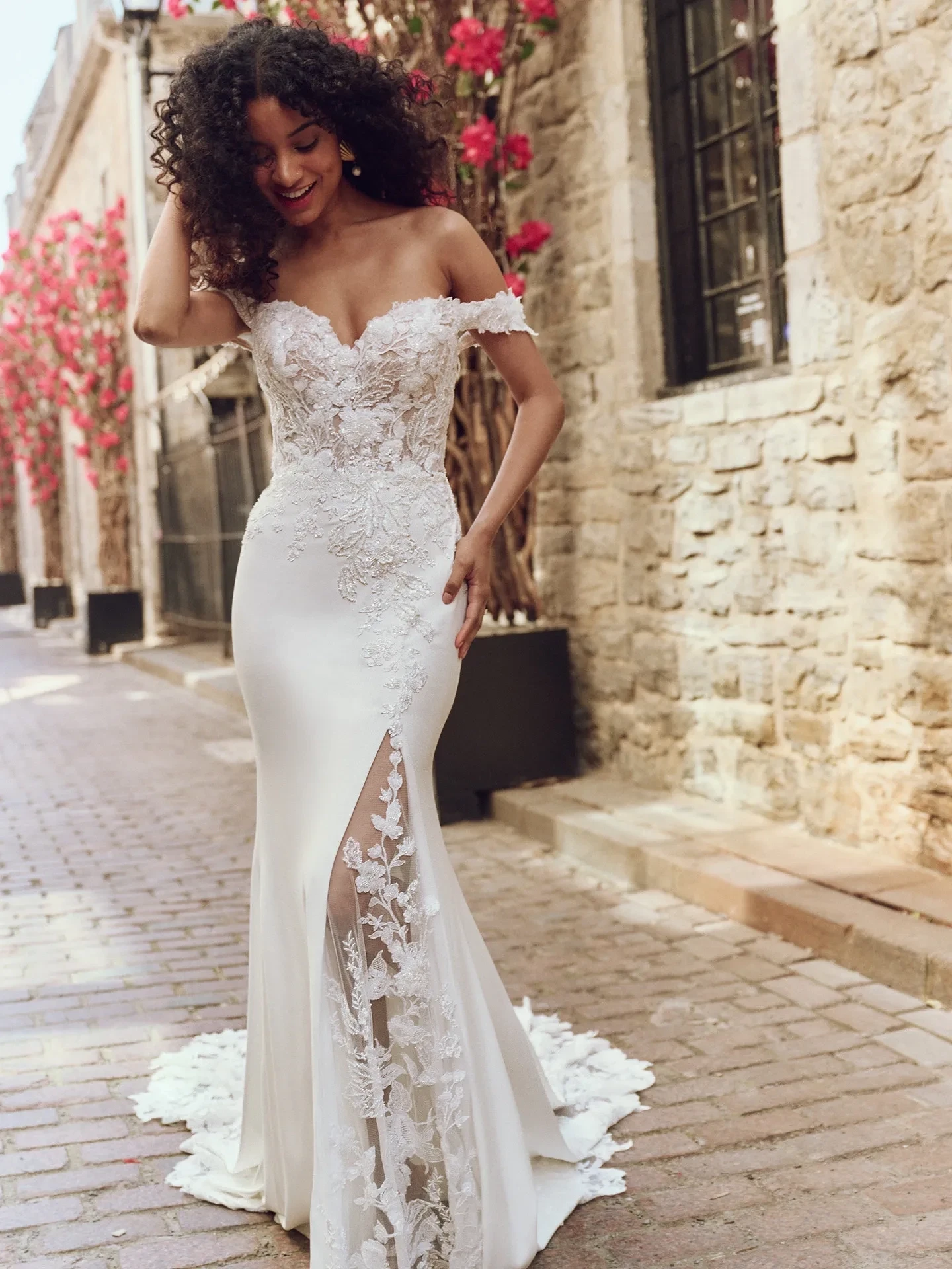 Model wearing a gown by Rebecca Ingram