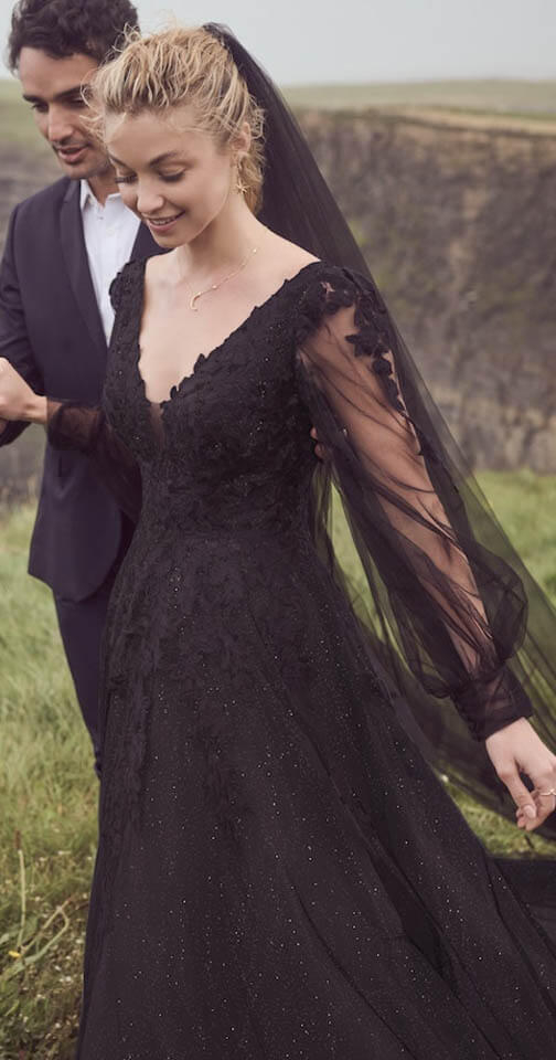 Сouple wearing a black gown and a black suit